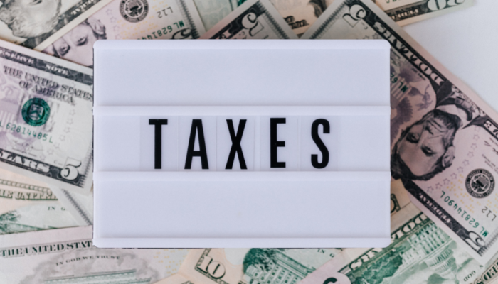 Taxes and US bills image to denote NetSuite deals with global taxes to negate incorrect billing and ensure businesses are fully compliant. 