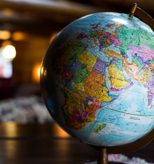 Image of a globe on a table to denote what businesses need to focus on when approaching global expansion.
