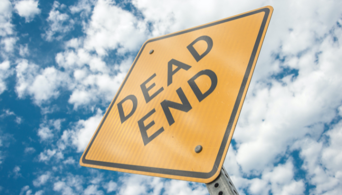 Sign saying dead en with blue sky and clouds in background to denote 5 signs your CRM solution is out of date and costing your organisation.