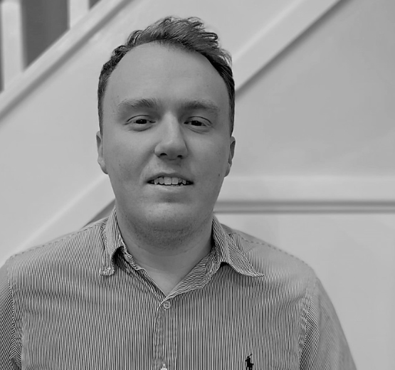 Black and white image of Jack who is one of BrightBridge's NetSuite Technical Consultants - pictured for National Careers Week 2023.