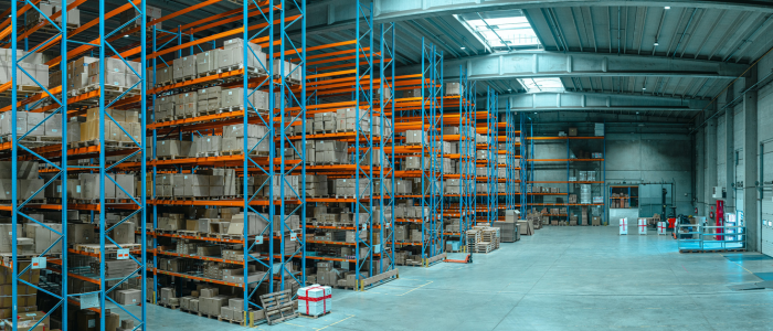 Image of inside a large warehouse with multiple high racking at company that uses NetSuite to manage its inventory.